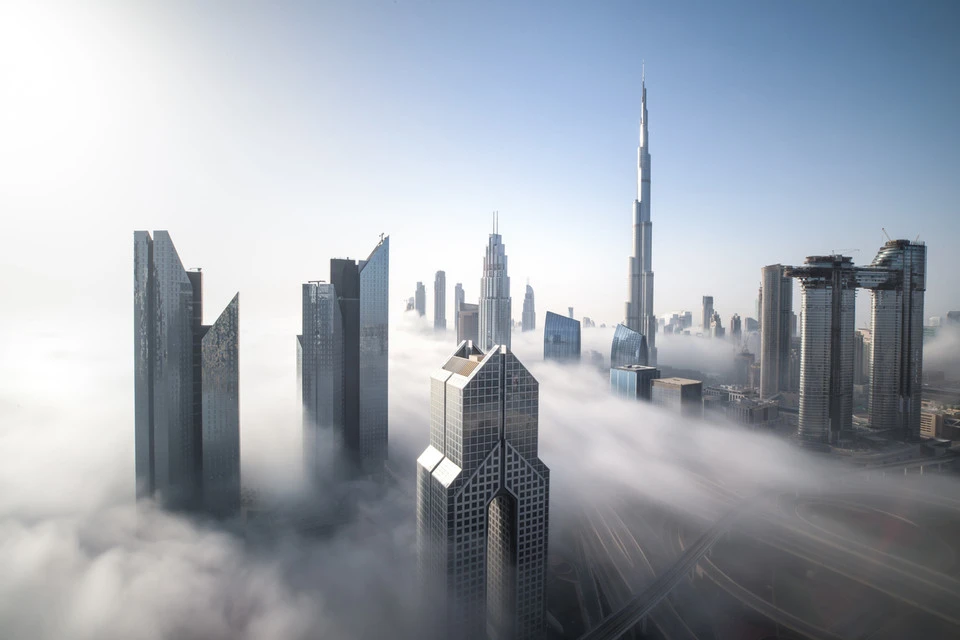 Dubai Downtown skyline on a foggy winter day.