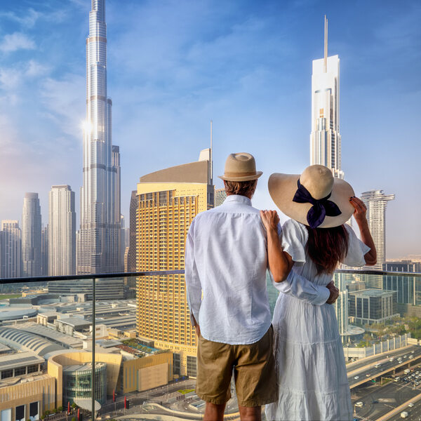A couple enjoys the view over the city skyline of Dubai.